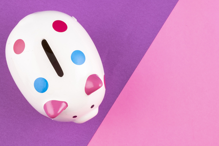 financial crisis concept, empty piggy bank on pastel color background. copy space for textの写真素材