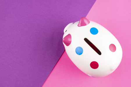 financial crisis concept, empty piggy bank on pastel color background. copy space for textの写真素材