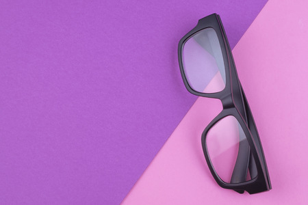 health concept,eye glasses spectacles with shiny black frame on pastel color background.copy space for textの写真素材