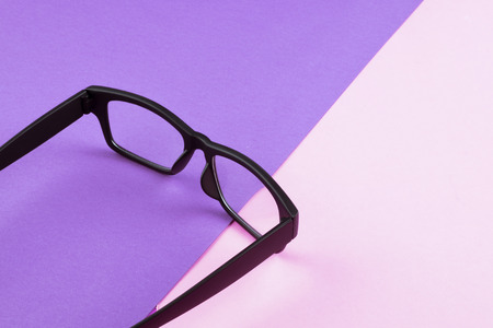 health concept,eye glasses spectacles with shiny black frame on pastel color background.copy space for textの写真素材