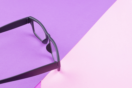 health concept,eye glasses spectacles with shiny black frame on pastel color background.copy space for textの写真素材