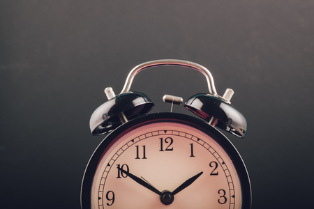 Time management concept, alarm clock on dark background. copy space for textの写真素材