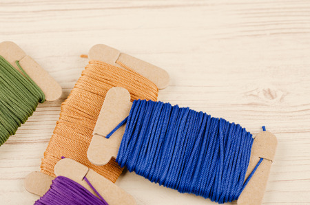 colorful stacking cotton yarn wool on wooden background. copy space for textの写真素材