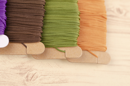 colorful stacking cotton yarn wool on wooden background. copy space for textの写真素材