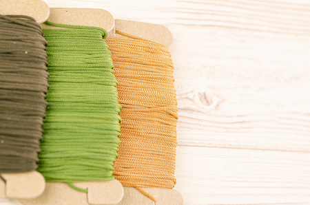 colorful stacking cotton yarn wool on wooden background. copy space for textの写真素材