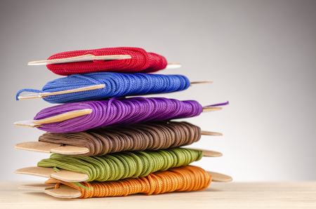 colorful stacking cotton yarn wool over beautiful reverberation gradient background.の写真素材