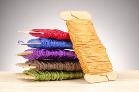 colorful stacking cotton yarn wool over beautiful reverberation gradient background.の写真素材