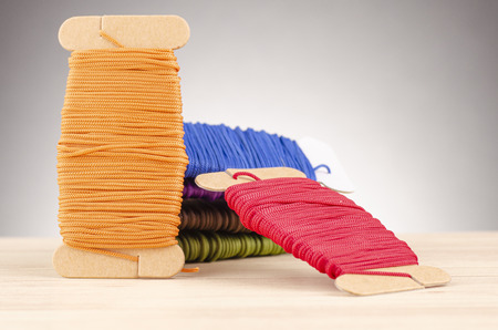 colorful stacking cotton yarn wool over beautiful reverberation gradient background.の写真素材