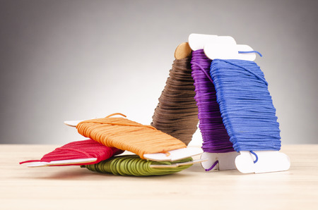 colorful stacking cotton yarn wool over beautiful reverberation gradient background.の写真素材