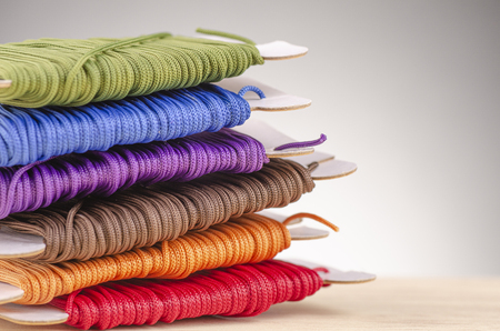 colorful stacking cotton yarn wool over beautiful reverberation gradient background.の写真素材