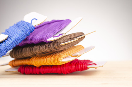 colorful stacking cotton yarn wool over beautiful reverberation gradient background.の写真素材