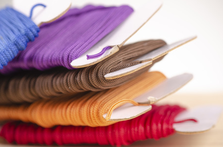 colorful stacking cotton yarn wool over beautiful reverberation gradient background.の写真素材