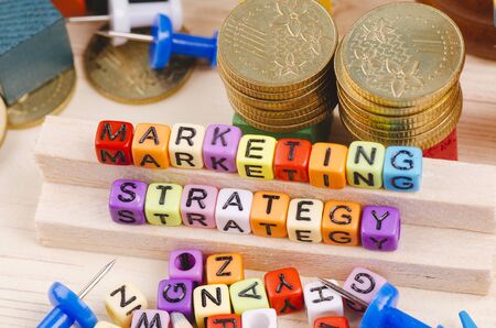 Business Campaign Concept background, colorful cube with word MARKETING STRATEGY on wooden deskの写真素材