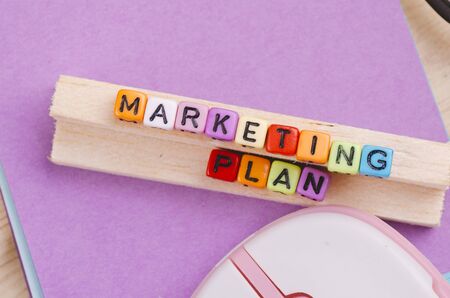 Business Campaign Concept background, colorful cube with word MARKETING PLAN on wooden deskの写真素材