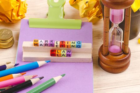 Business Campaign Concept background, colorful cube with word MARKETING PLAN on wooden deskの写真素材