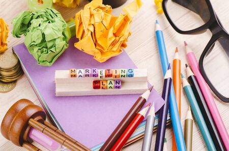 Business Campaign Concept background, colorful cube with word MARKETING PLAN on wooden deskの写真素材