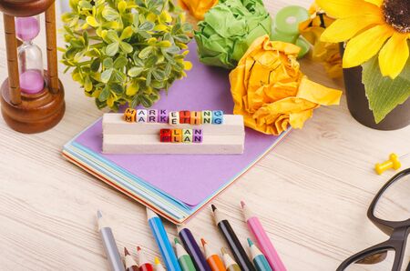 Business Campaign Concept background, colorful cube with word MARKETING PLAN on wooden deskの写真素材