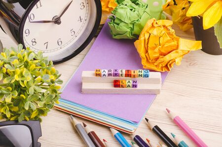 Business Campaign Concept background, colorful cube with word MARKETING PLAN on wooden deskの写真素材