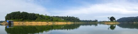 Beautiful image of rain-forest with reflection in water at Royal Belum State Park, Gerik Perak Malaysia.の写真素材