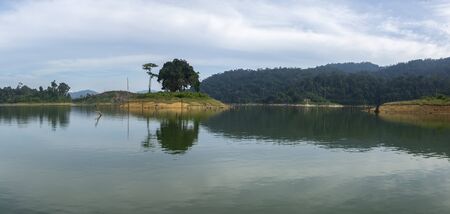 Beautiful image of rain-forest with reflection in water at Royal Belum State Park, Gerik Perak Malaysia.の写真素材