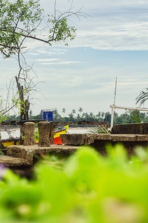 Beautiful rural scenery, abandon jetty or traditional fisherman dock over cloudy sky backgroundの写真素材