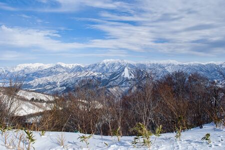 beautiful scenery from top view, mountains under the snow during winter timeの写真素材