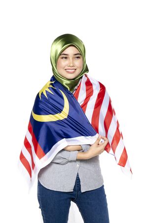 young and pretty woman with malaysian flag isolated on white backgroundの写真素材