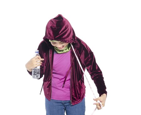 Portrait of a active healthy hijab woman drinking plain water in bottle for promoting a healthy fitness and lifestyle conceptの写真素材