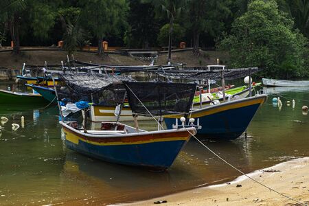 Beautiful rural scenery, fisherman boat moored near the sea shoreの写真素材