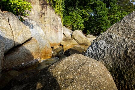 Scenic beach with island,rocks and turquoise sea water against sky in Pangkor island, Malaysiaの写真素材