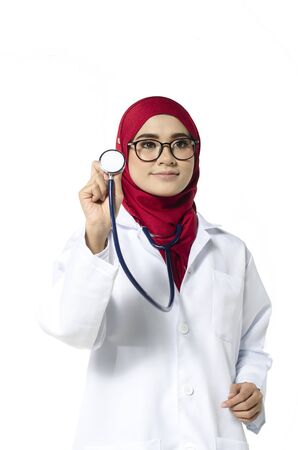 Medical and healthcare concept, confident young doctor standing with smile face holding stethoscopeの写真素材