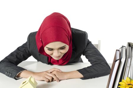 Student and business concept,young woman with hijab women in suit sitting over white backgroundの写真素材