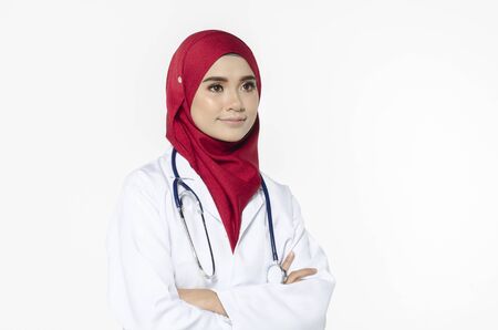Medical and healthcare concept, confident young doctor standing with smile face holding stethoscopeの写真素材