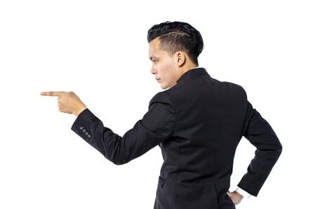 young handsome businessman standing and pointing his finger over white backgroundの写真素材