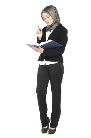 Student and business concept,young woman with hijab in suit standing over white backgroundの写真素材
