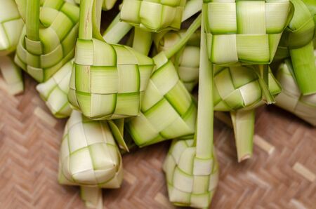 ketupat casing and rice in bamboo container. traditional malay delicacy during Malaysian eid festivalの写真素材