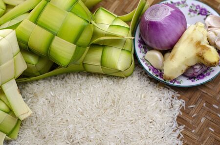 ketupat casing and rice in bamboo container. traditional malay delicacy during Malaysian eid festivalの写真素材