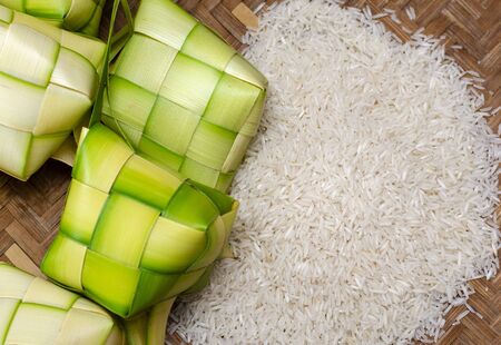 ketupat casing and rice in bamboo container. traditional malay delicacy during Malaysian eid festivalの写真素材