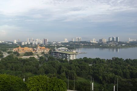 Beautiful scenery Putrajaya city surrounding by lake over cloudy sky backgroundの写真素材