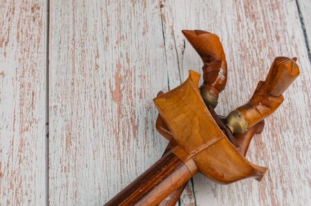 Traditional dagger called Keris on wooden background, Keris  is unique icon among Malay Ethnic cultural history in Malaysiaの写真素材