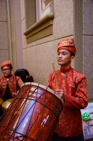 KUALA LUMPUR, MALAYSIA 12 JULY 2017: Group of Malaysian with songket performing Gamelan Orchestra and modern music instrumentのeditorial素材