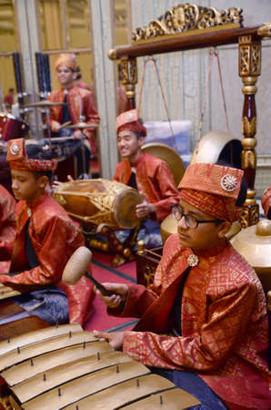 KUALA LUMPUR, MALAYSIA 12 JULY 2017: Group of Malaysian with songket performing Gamelan Orchestra and modern music instrumentのeditorial素材