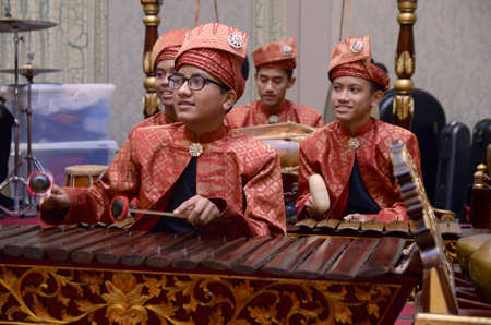KUALA LUMPUR, MALAYSIA 12 JULY 2017: Group of Malaysian with songket performing Gamelan Orchestra and modern music instrumentのeditorial素材