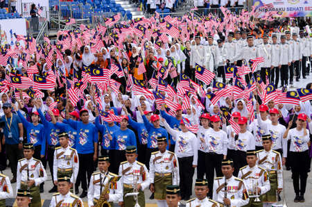 KUALA LUMPUR, MALAYSIA - 29 August 2017 :Crowd waving Malaysian Jalur Gemilang flag during the full rehearsal for Malaysian Independence Day celebration.のeditorial素材