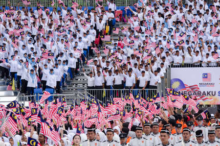KUALA LUMPUR, MALAYSIA - 29 August 2017 :Crowd waving Malaysian Jalur Gemilang flag during the full rehearsal for Malaysian Independence Day celebration.のeditorial素材