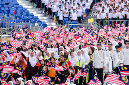 KUALA LUMPUR, MALAYSIA - 29 August 2017 :Crowd waving Malaysian Jalur Gemilang flag during the full rehearsal for Malaysian Independence Day celebration.のeditorial素材