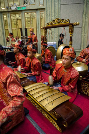 KUALA LUMPUR, MALAYSIA 12 JULY 2017: Group of Malaysian with songket performing Gamelan Orchestra and modern music instrumentのeditorial素材
