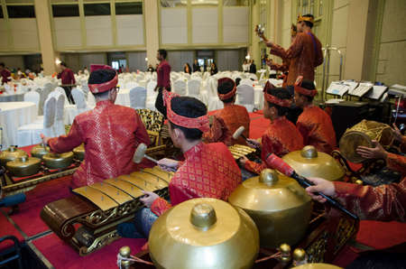 KUALA LUMPUR, MALAYSIA 12 JULY 2017: Group of Malaysian with songket performing Gamelan Orchestra and modern music instrumentのeditorial素材