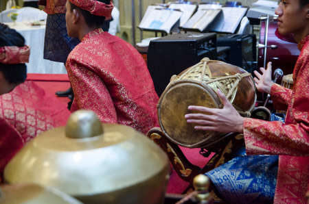 KUALA LUMPUR, MALAYSIA 12 JULY 2017: Group of Malaysian with songket performing Gamelan Orchestra and modern music instrumentのeditorial素材