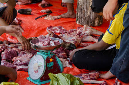 Kuala Terengganu, Malaysia - September 3, 2017: Group of Malaysian Muslims community butchering cow's meat during Eid Al-Adha Mubarak celebration, the Festival of Sacrifice to remember the story of Prophet Abraham and his son, Ismaelのeditorial素材